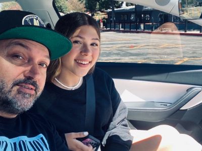 Cody Herpin is taking a selfie in a car with Zoie Laurel May Herpin.